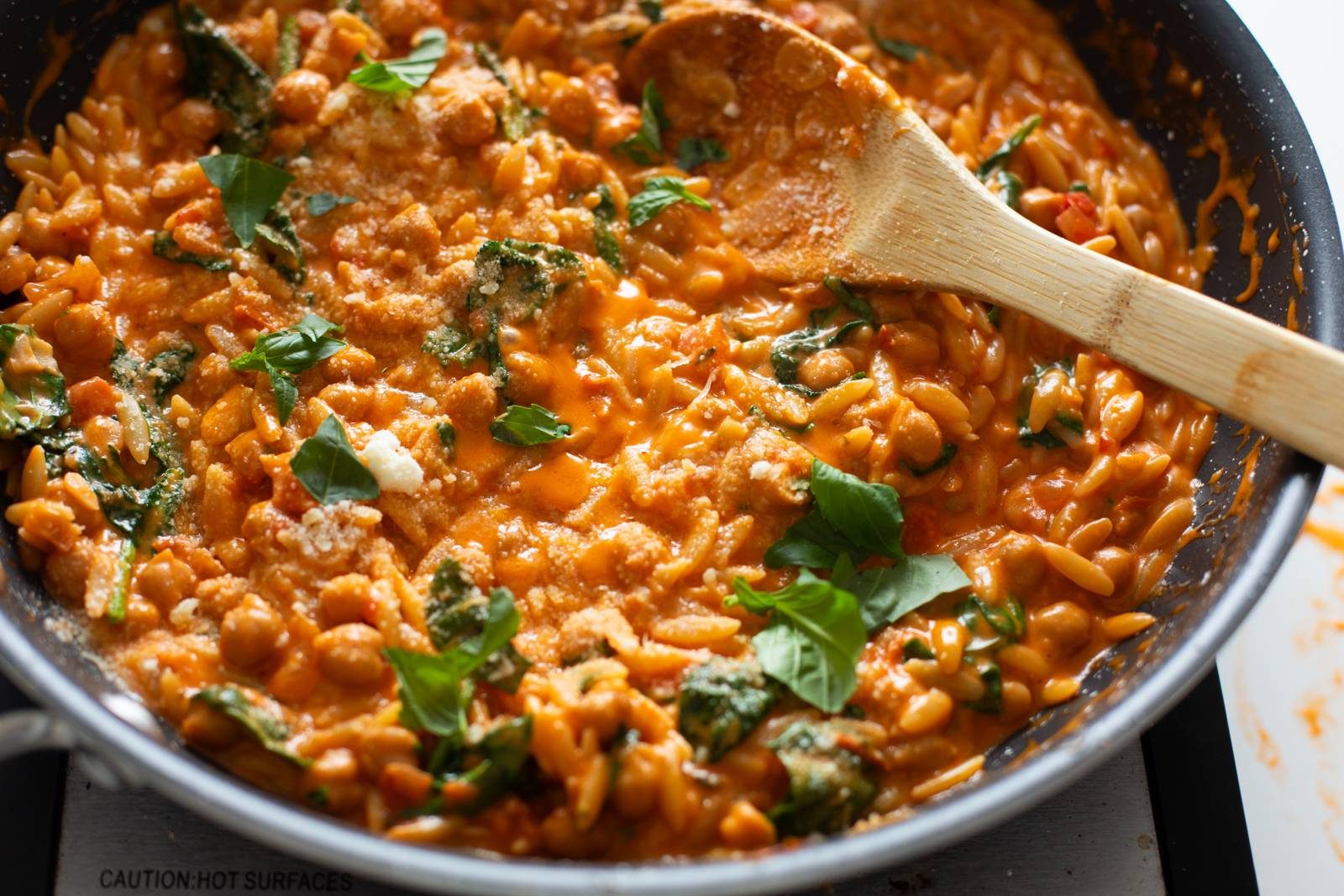 Finished marry me chickpeas and orzo in a pan.