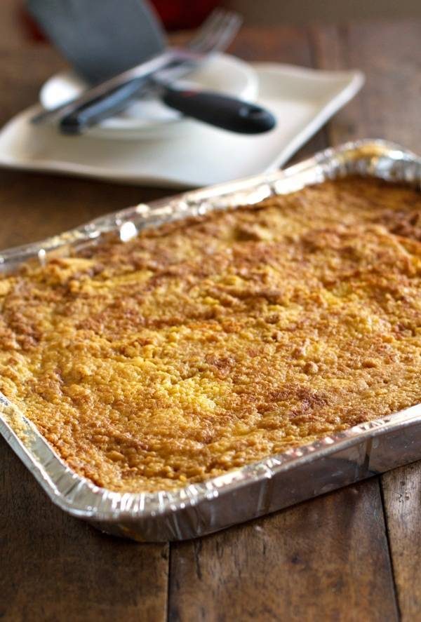 Pumpkin dessert bars in a tin dish.