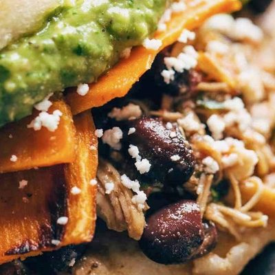 Arepas with sweet potato, carnitas, and black beans.