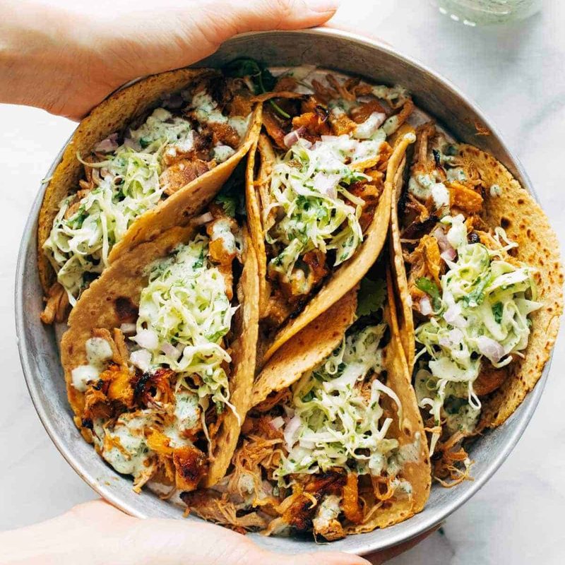 Chicken tacos on a plate.
