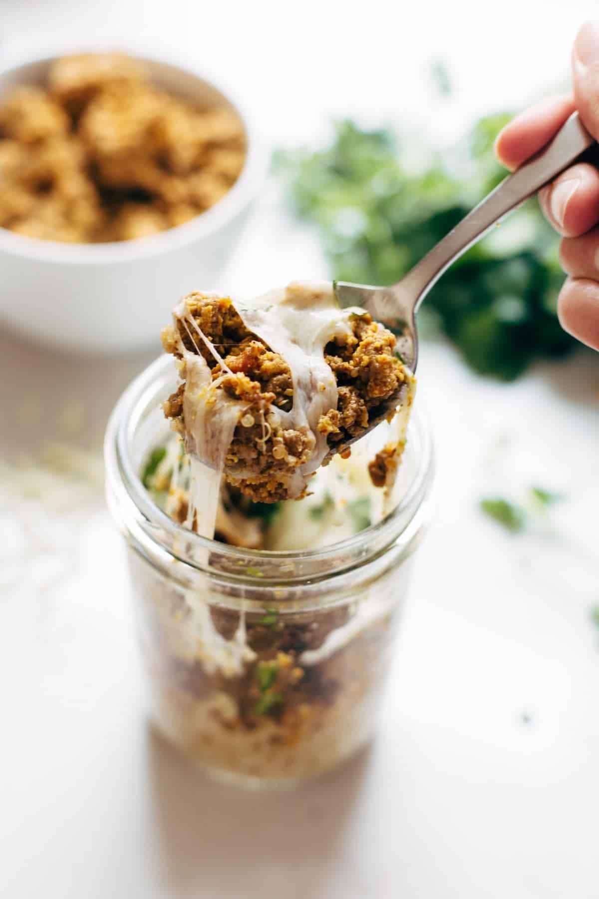 Southwest Turkey Breakfast Stacks in a jar with a spoon.