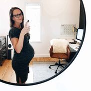 Lindsay taking selfie in an office.